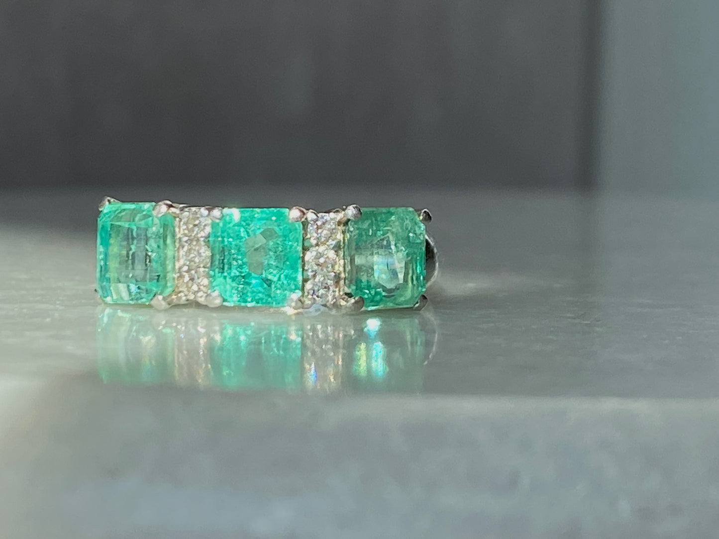 Emeralds and Diamonds Ring in Platinum